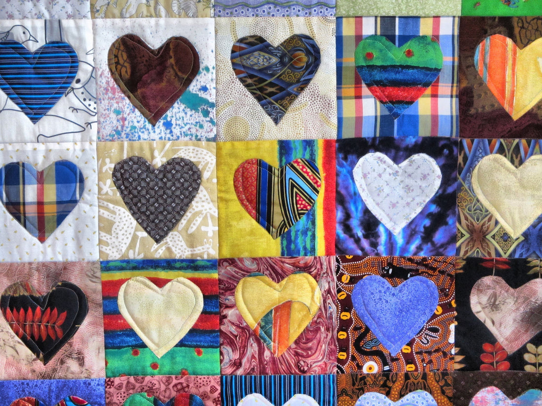 Colorful weighted blanket filled with smooth Victory Pellets, folded neatly to show vibrant fabric and even weight distribution–ideal for sensory comfort and DIY therapy tools.