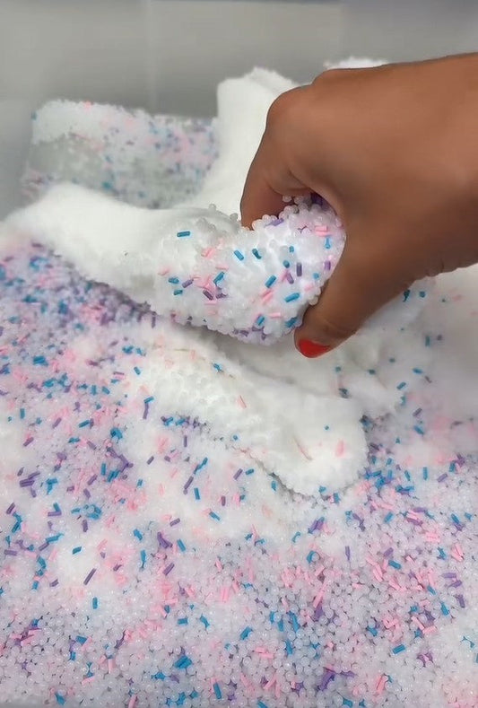 Nichole Jacklyne playing with Slushee Slime filled with Victory Pellets poly beads and baby blue, pink, and purple confetti charms while performing ASMR triggers like pouring, popping, poking, and stretching