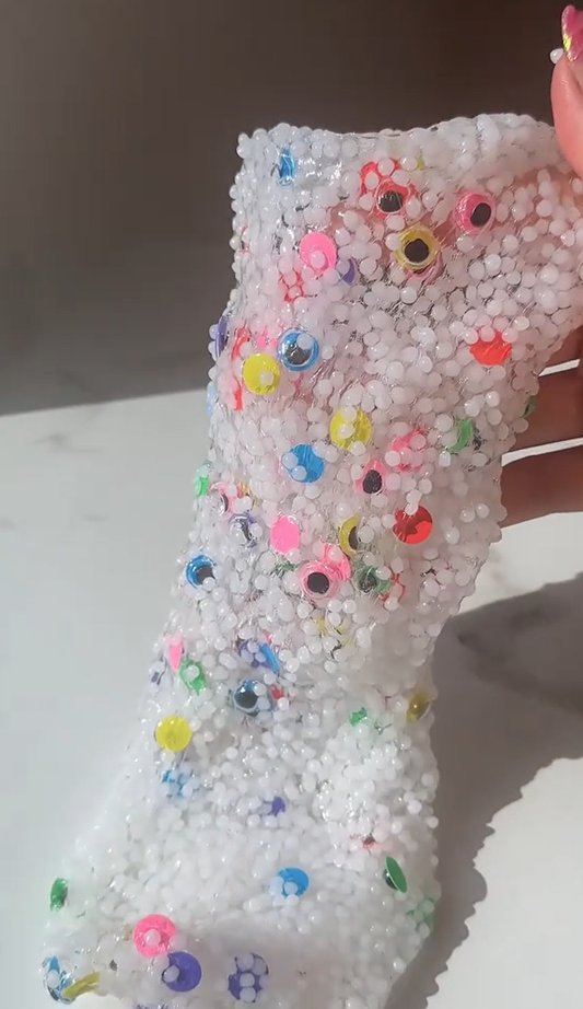 Victory Pellets slushee slime crafted by Nichole Jacklyne, featuring crunchy poly beads and spooky eyeball accents for sensory play and Halloween crafts