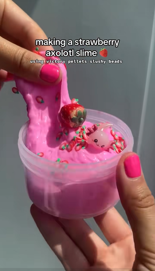 Victory Pellets slushee slime by Nichole Jacklyne, featuring strawberry-colored axolotl beads for a crunchy, squishy sensory craft experience