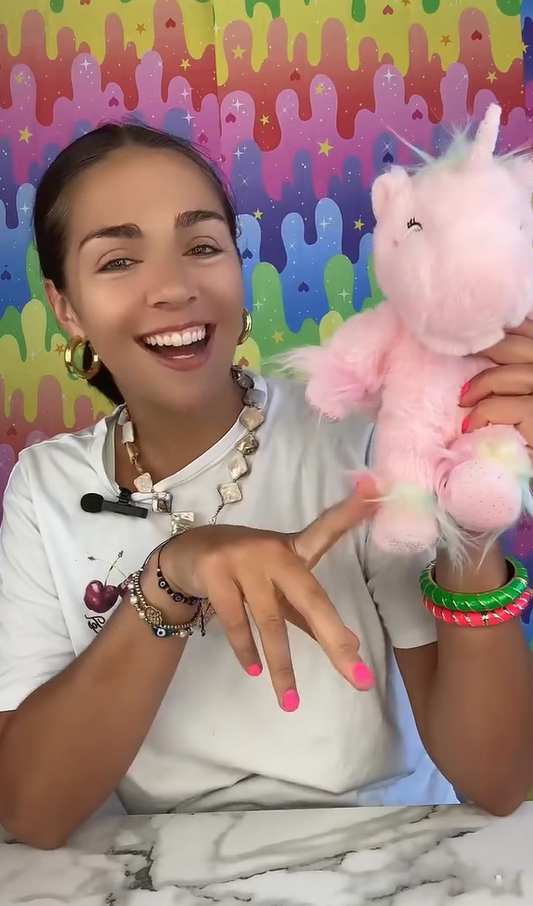 Stuffed unicorn toy filled with Victory Pellets poly beads, used as a craft filler for plush texture and sensory weight