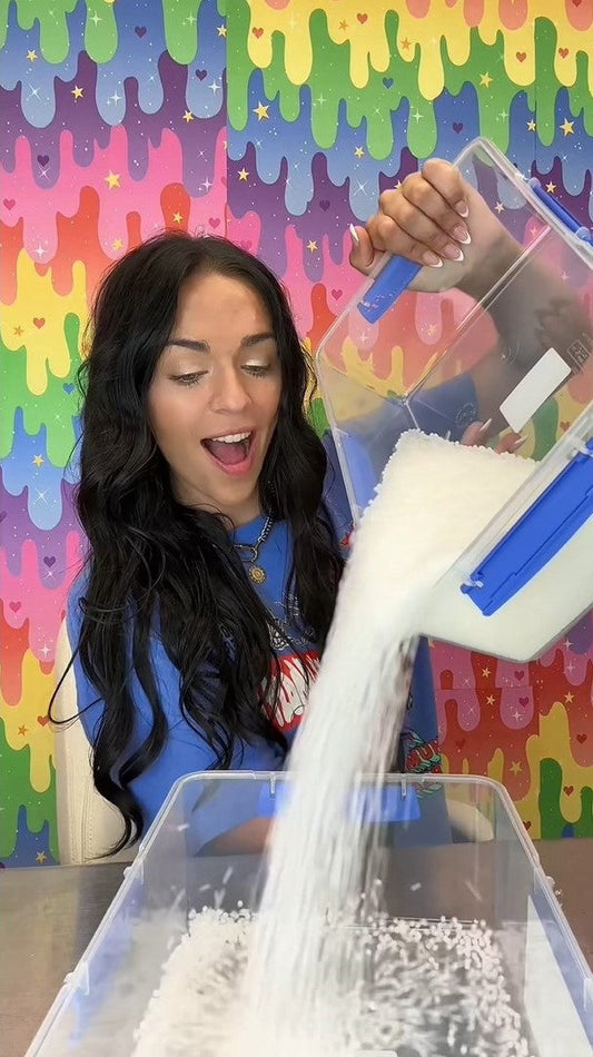 Nichole Jacklyne creating ASMR Slushee Slime Triggers by pouring, popping, poking, and stretching crunchy slime made with Elmer’s School Glue and Victory Pellets—delivering satisfying sounds and textures in a vibrant DIY setup.